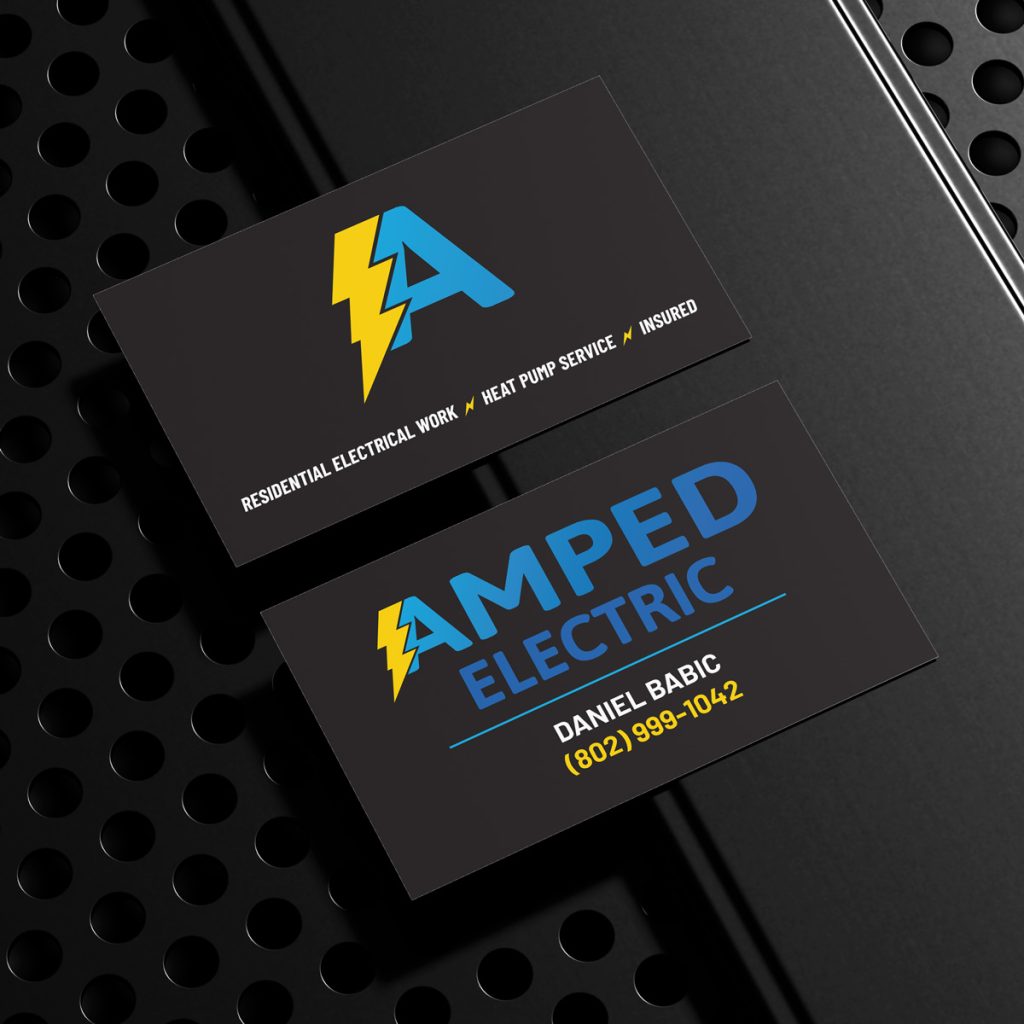 Front and back of a business card for Amped Electric, featuring a lightning bolt logo in yellow and blue, contact info for Daniel Babic, and services listed as residential electrical work, heat pump service, and insured.