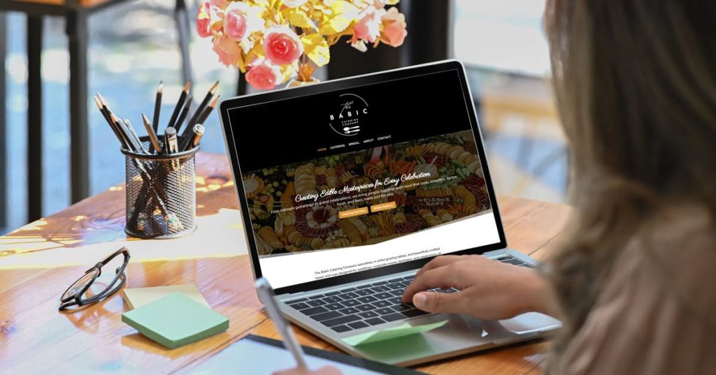 Laptop displaying the Babic Catering Co website