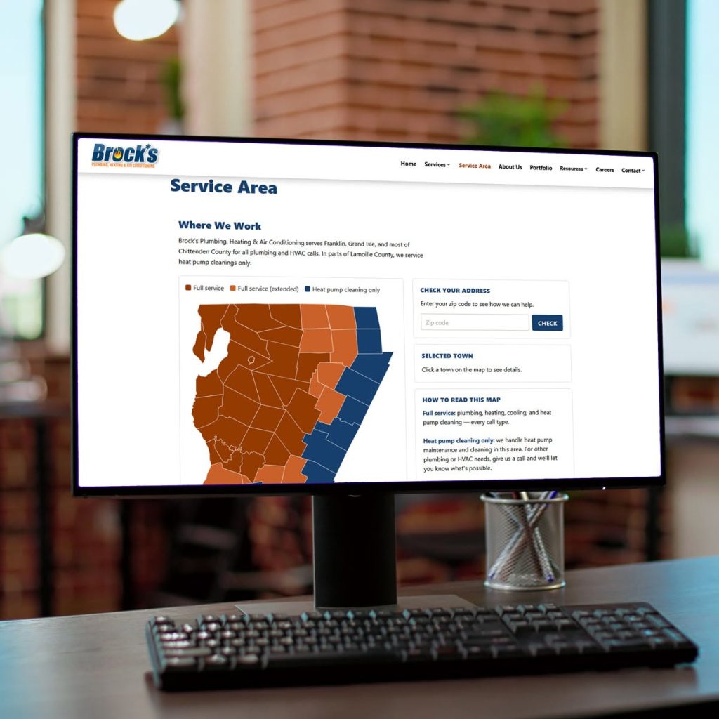 Computer monitor displaying a service area map on Brock's Heating website