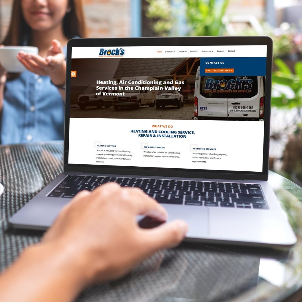 Laptop displaying Brock's Heating Website
