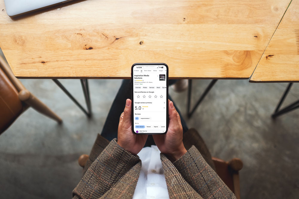 Woman looking at a Google Review screen on her phone